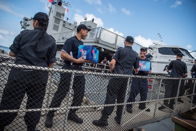 HMNZS Wellington being loaded with aid in Fiji post-Cylone Winston. Image: NZ Defence Force