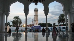 People gather at Baiturrahman Grand Mosque at dusk in Banda Aceh, Aceh province, Indonesia. A local law that makes gay sex punishable by public caning took effect in October last year. Image: AP