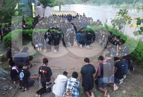 Students pray on campus while most students have been staging sit-in protests in groups. Image: LoopPNG