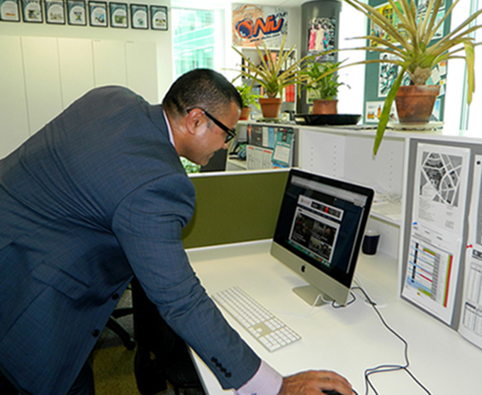 Pacific Cooperation Foundation CEO Laulu Mac Leauanae turns the new AsiaPacificReport website "live" in Aucklland today. Image: Del Abcede/PMC