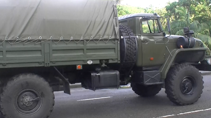 Newly donated Russian military trucks were used in the clean-up operation in Suva today, Image: Fiji One News