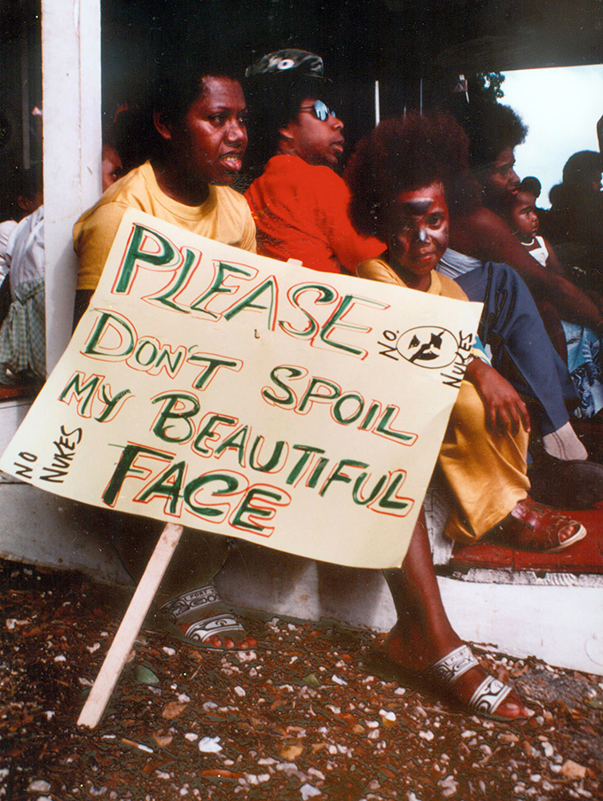 June Keitadi with her family's "No nukes" placard at Independence Park, Port Vila, 1983. Photo: David Robie