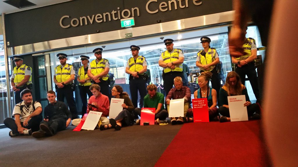 Protesters blockading the main entrance at Sky City today. Image: Greenpeace