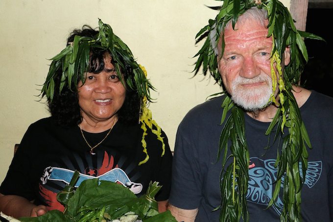 Del Abcede and David Robie in ceremonial headdress - "usually reserved for chiefs" - at the welcome feast on Aneityum Island. Image: PMC