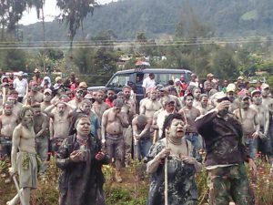 Mothers cover their faces and bodies in mud as a symbol of mourning for Graham Romanong. Image: Supplied