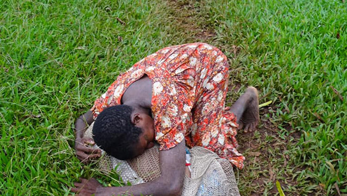 A weeping mum from PNG and her long walk for a dying child