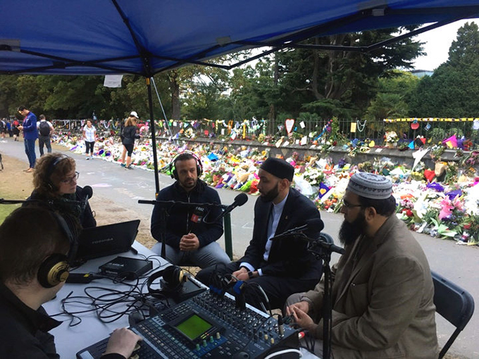 Susie Ferguson, Mohamed Hassan, Omar Suleiman and Qasim Rashid Ahmad discuss issues around the Christchurch mosque attacks from the RNZ special broadcast outside the Botanic Gardens. Image: RNZ