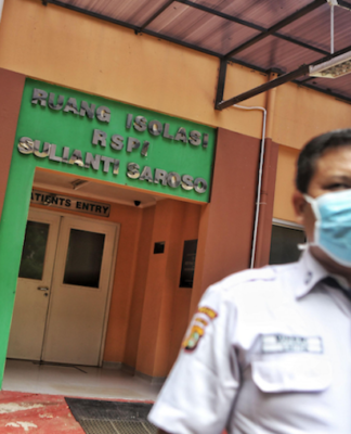 Indonesian coronavirus patients hit by lack of privacy legal safeguards Jakarta hospital security giard