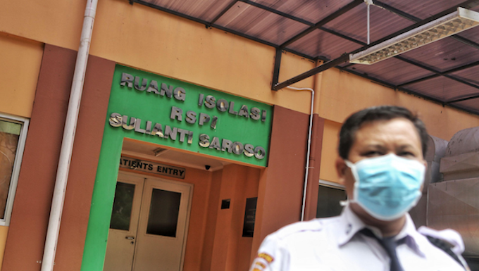 Indonesian coronavirus patients hit by lack of privacy legal safeguards Jakarta hospital security giard