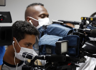 Journalists with facemasks