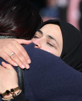 A supporter hug at Christchurch sentencing