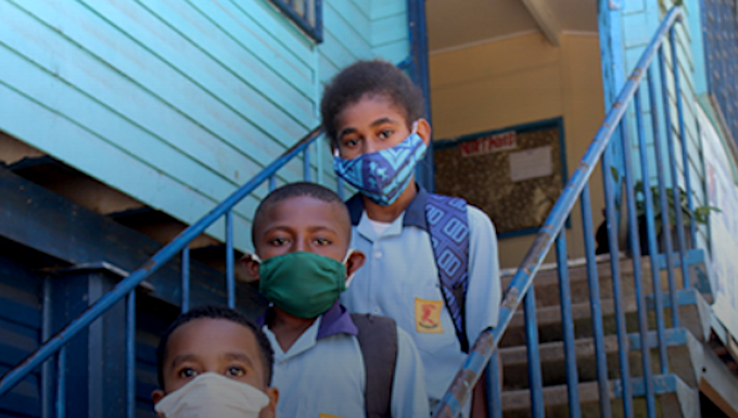 PNG schools follow no-mask-no-entry rule amid growing covid cases Masked PNG schoolchildren