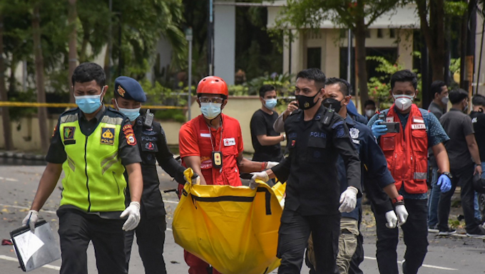 Indonesian police carry remains