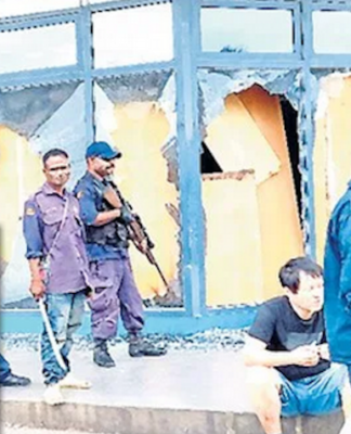 Police guard looted shop