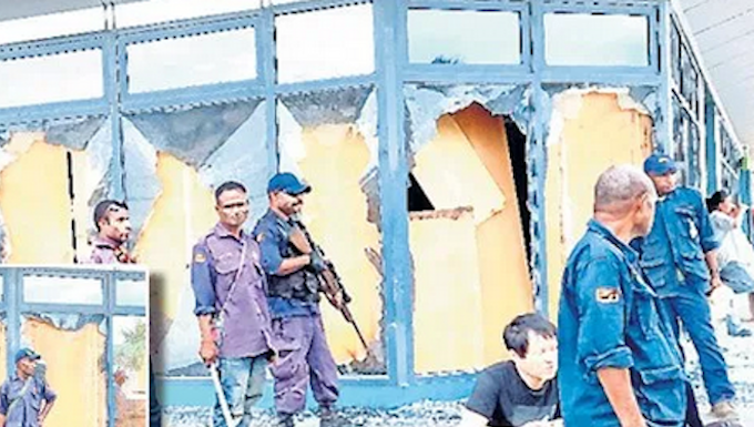 Police guard looted shop