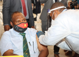 PNG Prime Minister James Marape being vaccinated