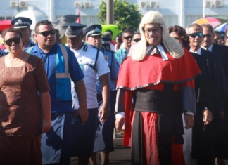 Samoan Chief Justice Satiu Simativa Perese walks to Parliament