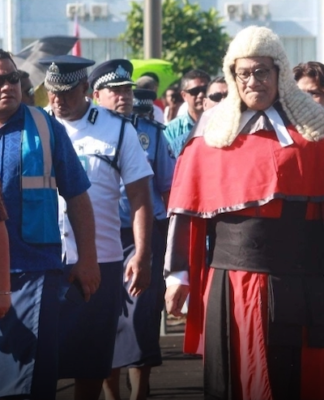 Samoan Chief Justice Satiu Simativa Perese walks to Parliament
