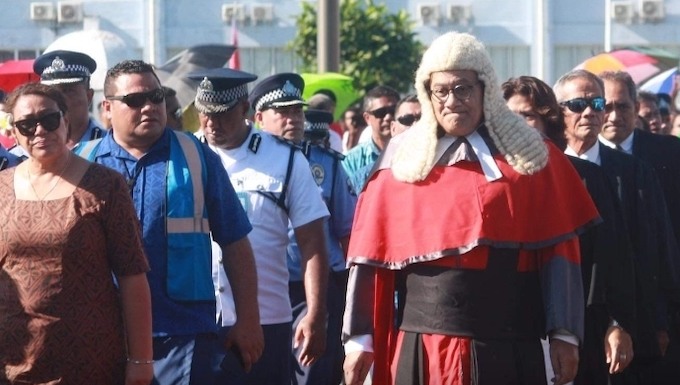 Samoan Chief Justice Satiu Simativa Perese walks to Parliament