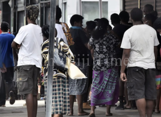 Fijians line up to access their F$90 government assistance