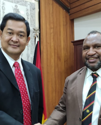 Andriana Supandy (left) and James Marape