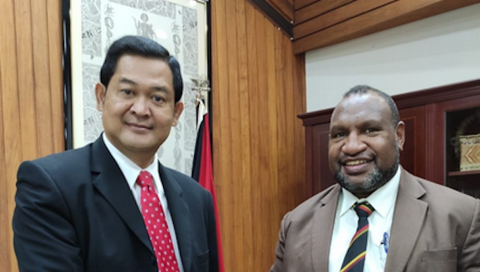 Andriana Supandy (left) and James Marape