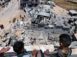 Palestinian children and Gaza bomb site