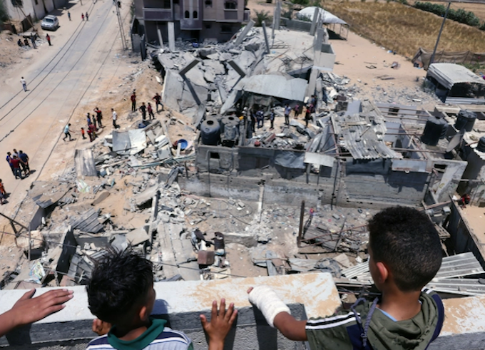 Palestinian children and Gaza bomb site