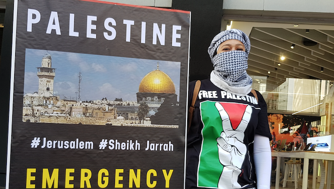 Many questions, few answers, as conflict deepens between Israelis and Palestinians Palestinian protester