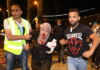 People helping an injured Palestinian woman