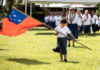 Samoan flag and child