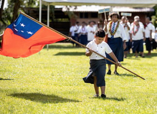 Samoan flag and child