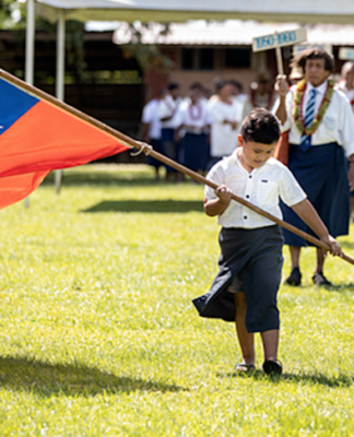 Samoan flag and child