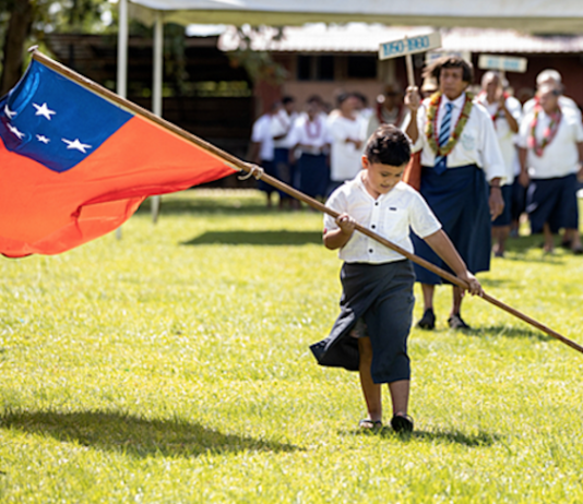 Samoan flag and child