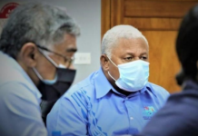 Fiji's Health Secretary Dr James Fong (left) and Prime Minister Voreqe Bainimarama