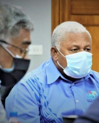 Fiji's Health Secretary Dr James Fong (left) and Prime Minister Voreqe Bainimarama