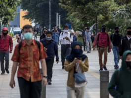 Masked office workers in Jakarta