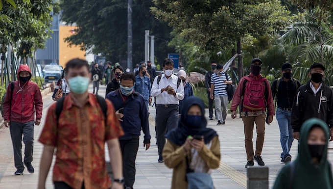 Masked office workers in Jakarta