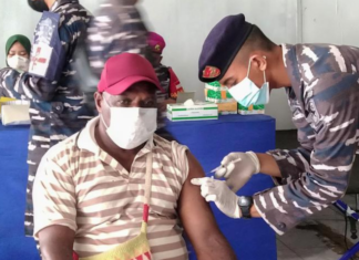 A Papuan man being vaccinated at Sorong, West Papua