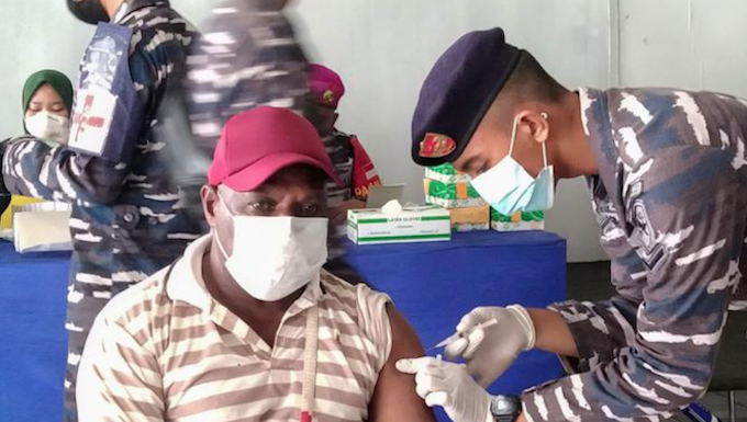 A Papuan man being vaccinated at Sorong, West Papua