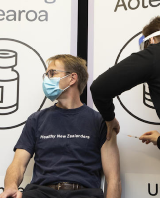 NZ reports 21 new covid community cases – outbreak total now 72 Dr Ashley Bloomfield being vaccinated