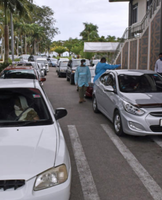 Girl, 15, among 11 dead as 968 new covid cases confirmed in Fiji Suva's drive through vaccination centre
