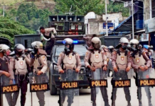 Indonesian riot police crackdown on UNCEN students.