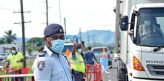 Fiji police at the Lomolomo border