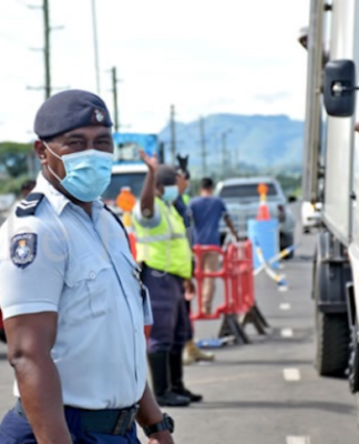 Fiji police at the Lomolomo border