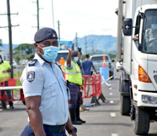 Fiji police at the Lomolomo border
