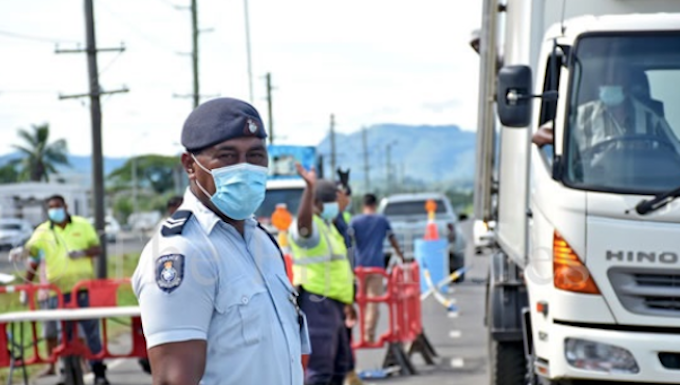 Fiji police at the Lomolomo border