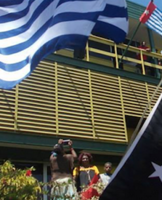 The West Papuan and PNG flags