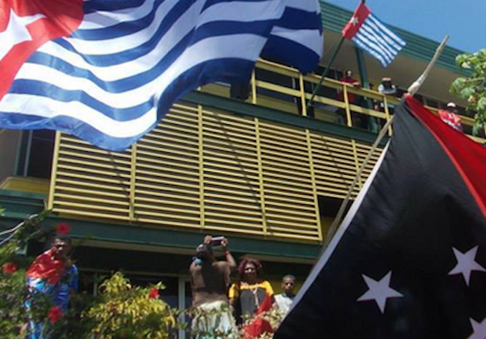 The West Papuan and PNG flags