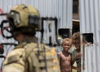 An Australian soldier on patrol in Honiara